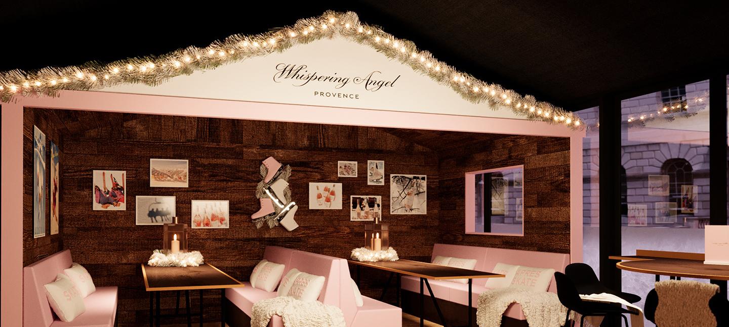 A render of how the Skate Lounge will look this year. It depicts a wood cabin with pale blush pink seating and fluffy blankets and cushions.