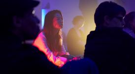 A photo of audience members at an event at Somerset House. The audience looks thoughtful and engaged.