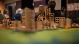 A model village built from MDF, with tower blocks and a ferris wheel.